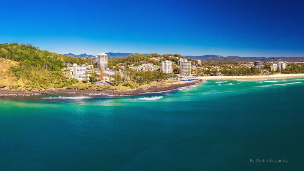 Burleigh Heads Beach Gold Coast with scenic headland, turquoise water, golden sand, and beachfront skyline