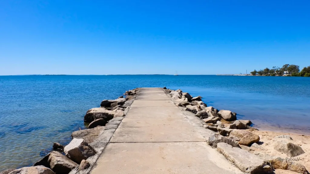 Manly Beach Brisbane jetty extending into Moreton Bay with calm blue water and clear sky