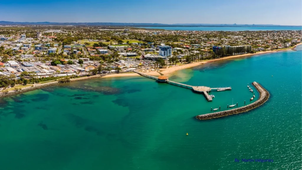 Aerial view of Redcliffe Beach in Brisbane, Queensland showing sandy foreshore, jetty, and surrounding town centre.