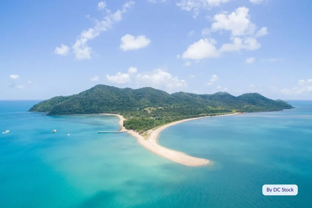 Aerial panorama of Dunk Island surrounded by turquoise ocean and rainforest-covered hills, Cassowary Coast, Queensland, Australia