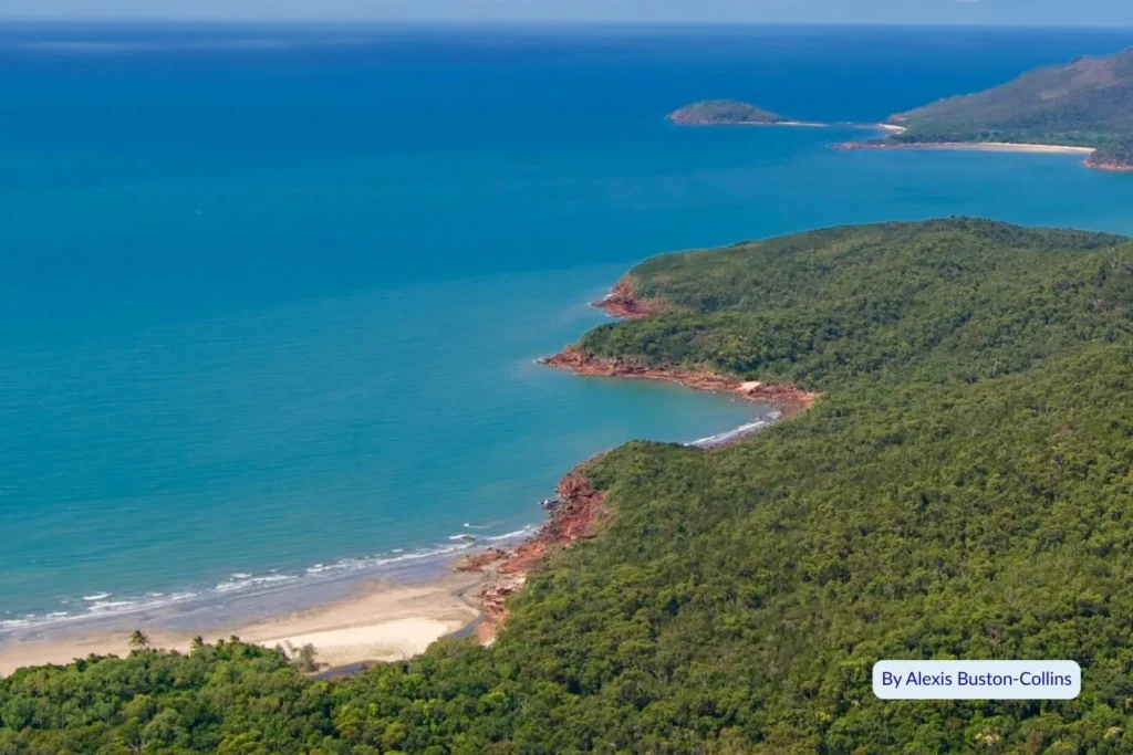 Scenic aerial view of forested headlands, rocky coves, and secluded beaches on Hinchinbrook Island, Far North Queensland