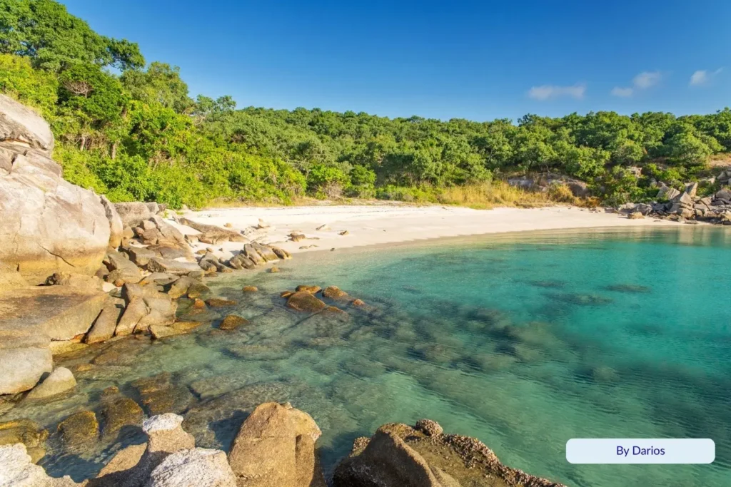 Crystal-clear bay with granite boulders and pristine beach at Lizard Island, Queensland, part of the Great Barrier Reef