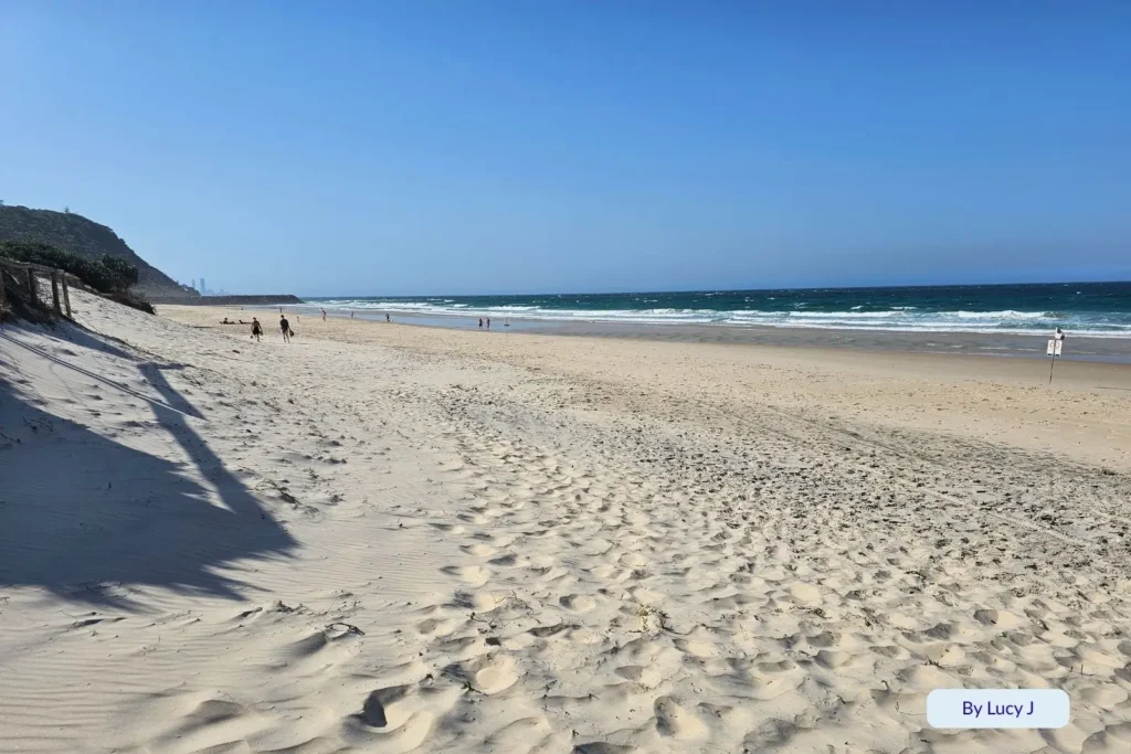 Soft sandy dunes leading down to turquoise waves at Tallebudgera Beach near Burleigh Head National Park, Gold Coast, Queensland, Australia
