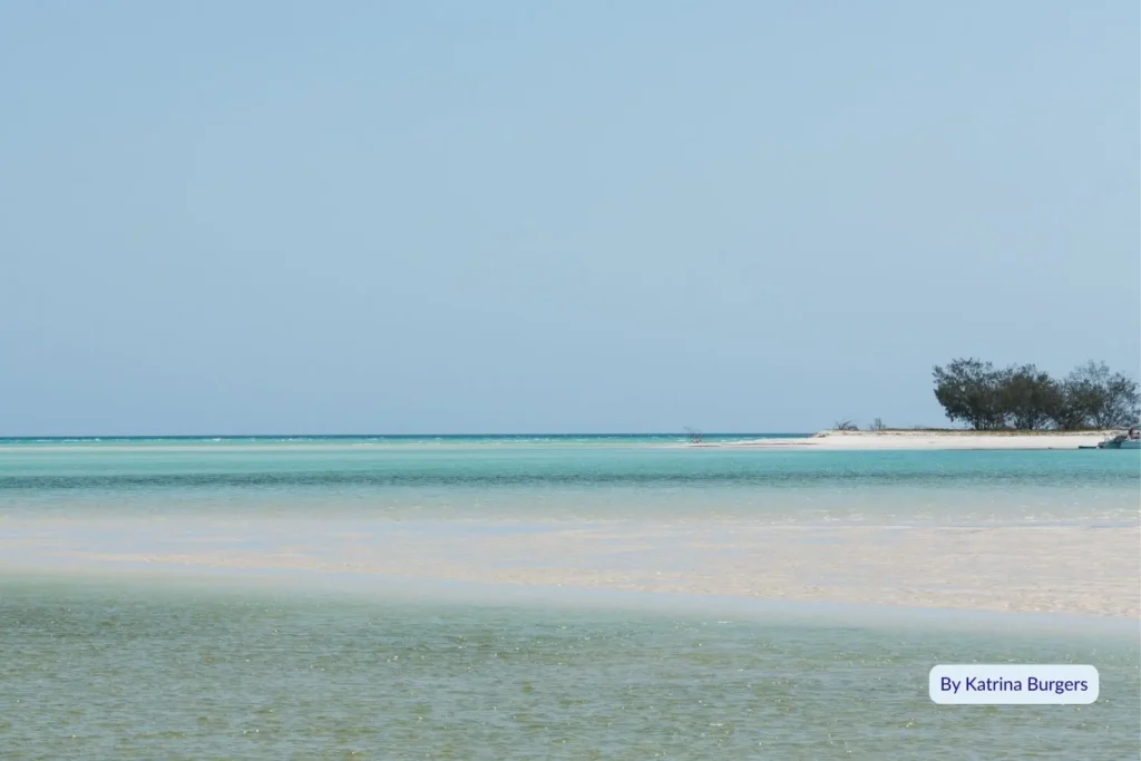 Shallow turquoise water and white sand flats at Wathumba Creek, Fraser Island (K’gari), on a clear sunny day overlooking the calm inlet to Platypus Bay.