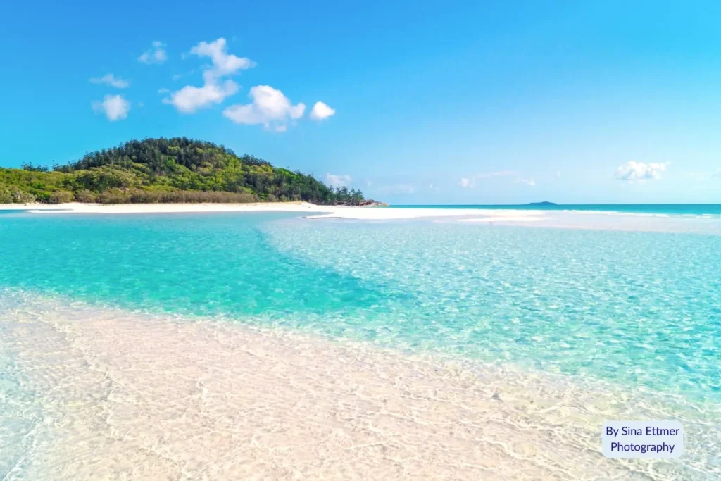 Turquoise shallows and pure white silica sand at Whitehaven Beach on Whitsunday Island, Queensland, Australia.