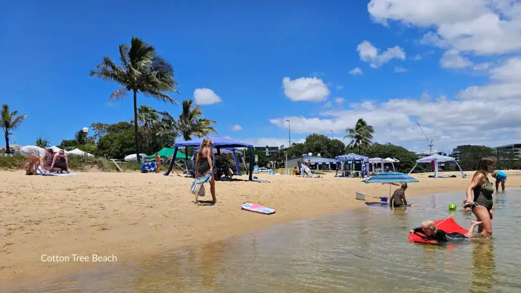 Family friendly beaches Queensland – families enjoying a calm beach day
