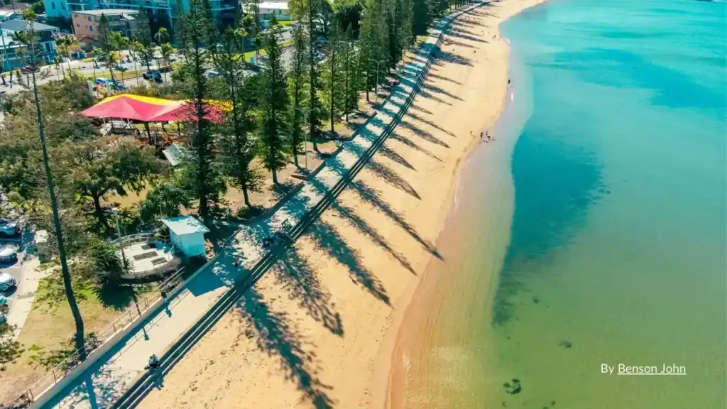 Family friendly beaches Queensland – wide sandy beach with shade and facilities ideal for families
