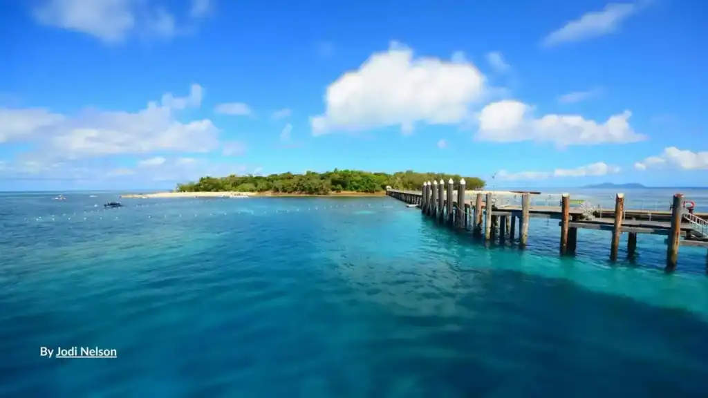 Green Island Cairns jetty and coral cay with turquoise Great Barrier Reef waters