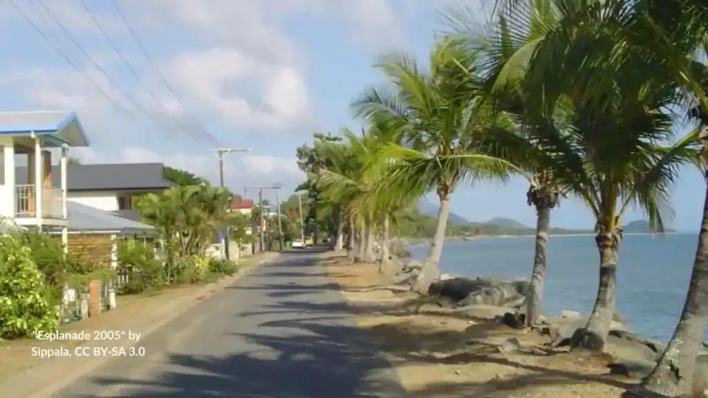 Quiet residential foreshore walk Machans Beach looking to mountains
