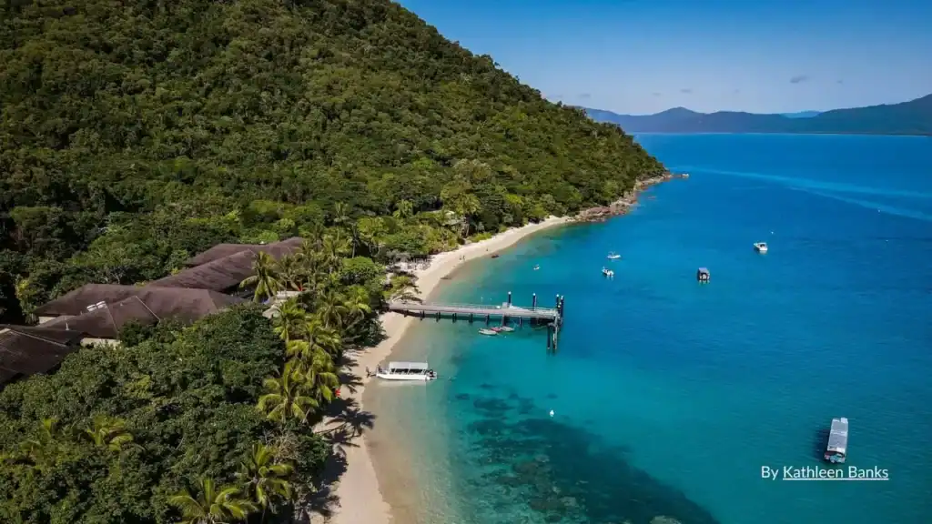 Aerial view of resort beach jetty and turquoise water at Palm Cove Cairns Queensland