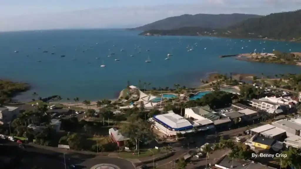 Aerial view of Airlie Beach lagoon, marina and Coral Sea, Whitsundays gateway Queensland