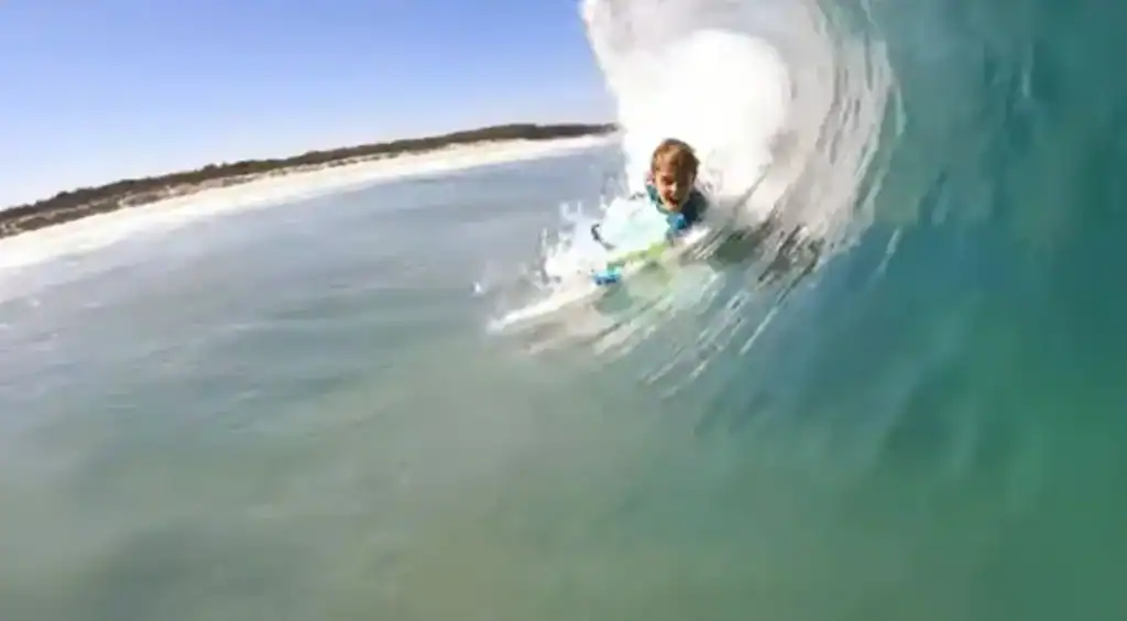 Child Surfer riding a wave at gold coast superbank