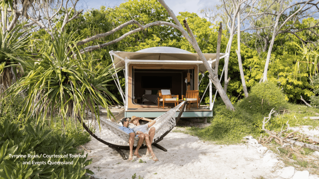 Wilson Island glamping tent with guests in a hammock in Queensland