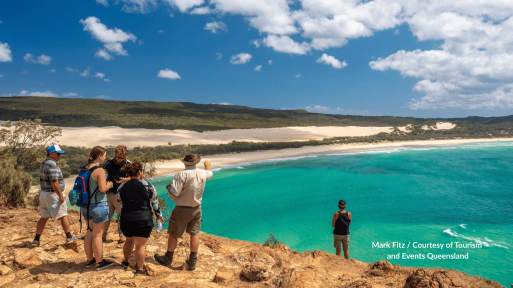 Visitors looking out from Indian Head on K'gari Queensland