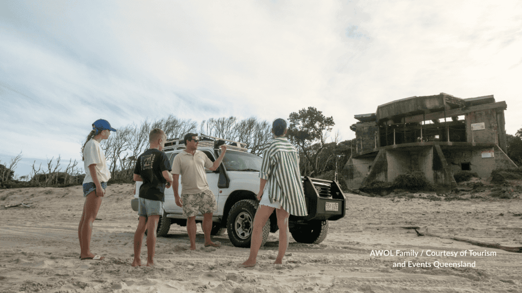Family with a 4WD beside the Fort Bribie WW2 ruins on Ocean Beach Bribie Island Queensland