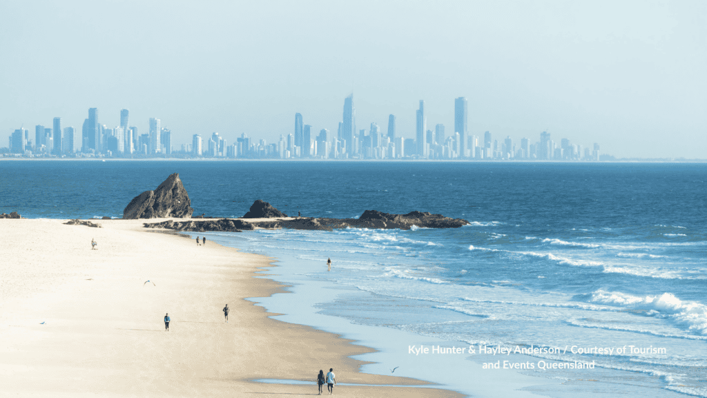 Looking north along Currumbin Beach Gold Coast Queensland toward the Surfers Paradise skyline