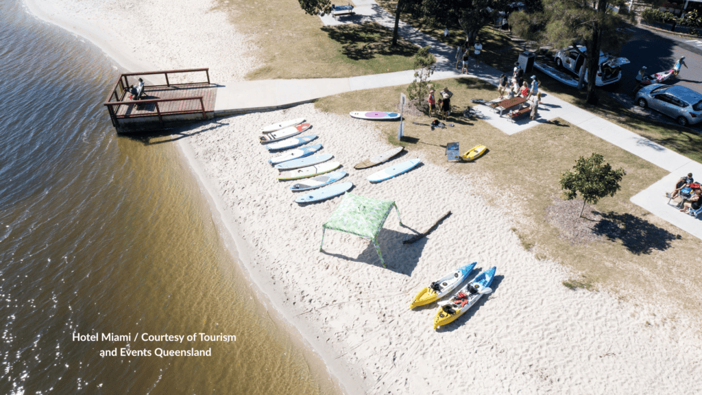 Kayaks and paddleboards on the sand at Budds Beach Gold Coast on the Nerang River Queensland