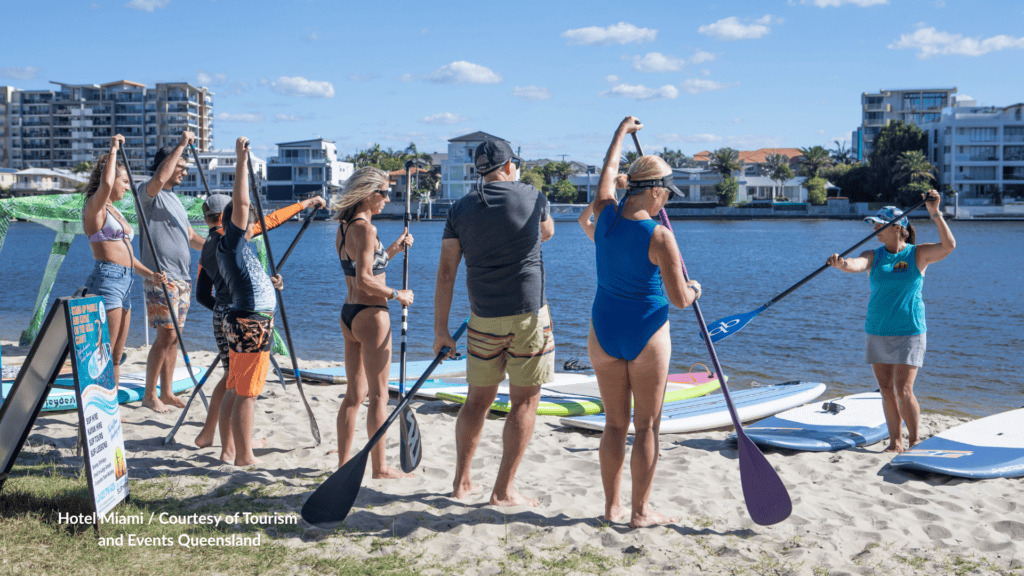 Stand up paddleboard lesson on the Nerang River sand at Budds Beach Gold Coast Queensland