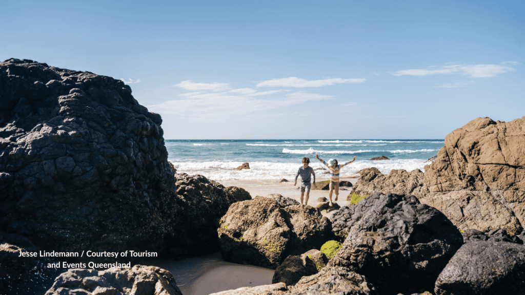 Kids playing on the rock pools at Kirra Beach Gold Coast Queensland
