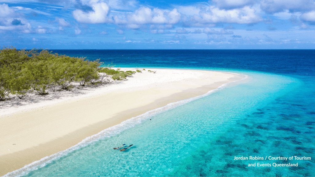 White sand beach and Wilson Island Queensland snorkelling in the shallows