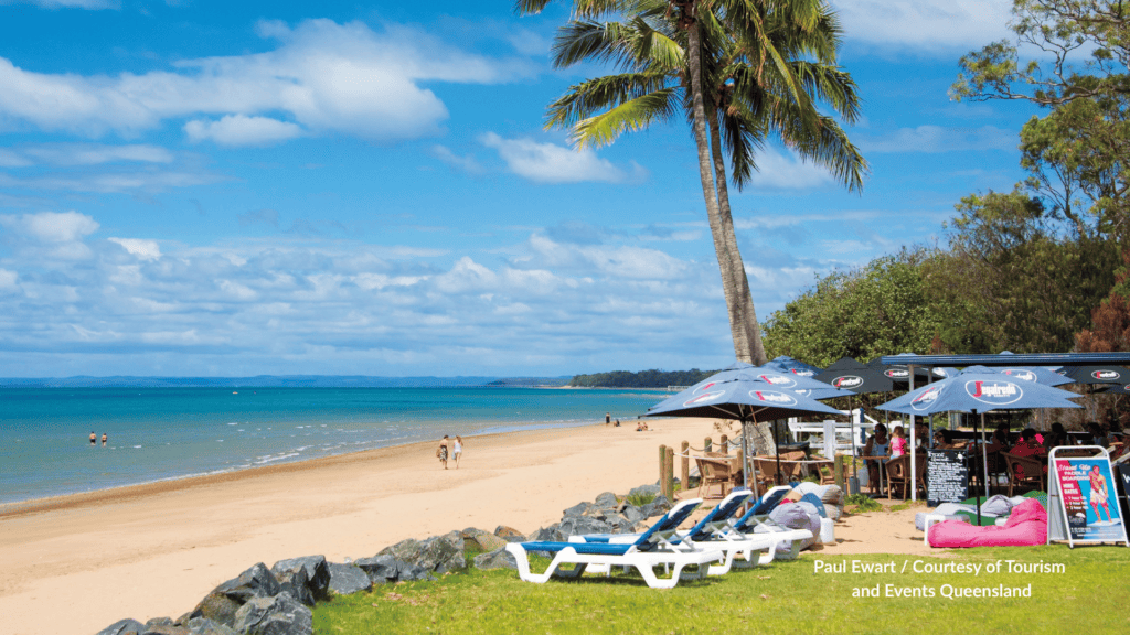 Beachfront cafe and sun loungers at Scarness Beach Hervey Bay Queensland