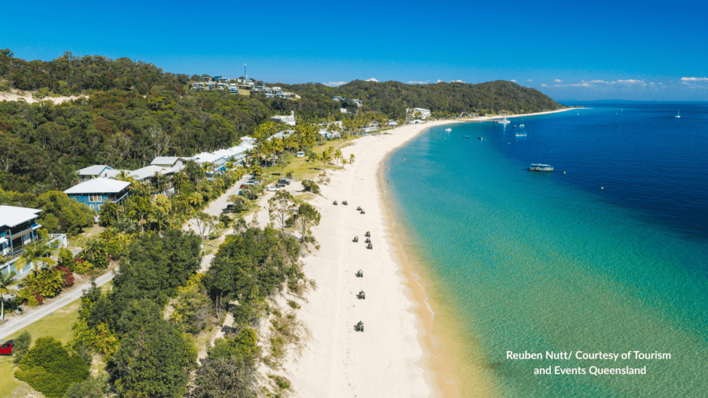 Aerial view of Tangalooma Beach Moreton Island with ATV Quad Bike Tour through the dunes and Tangalooma Island Resort beach in Queensland
