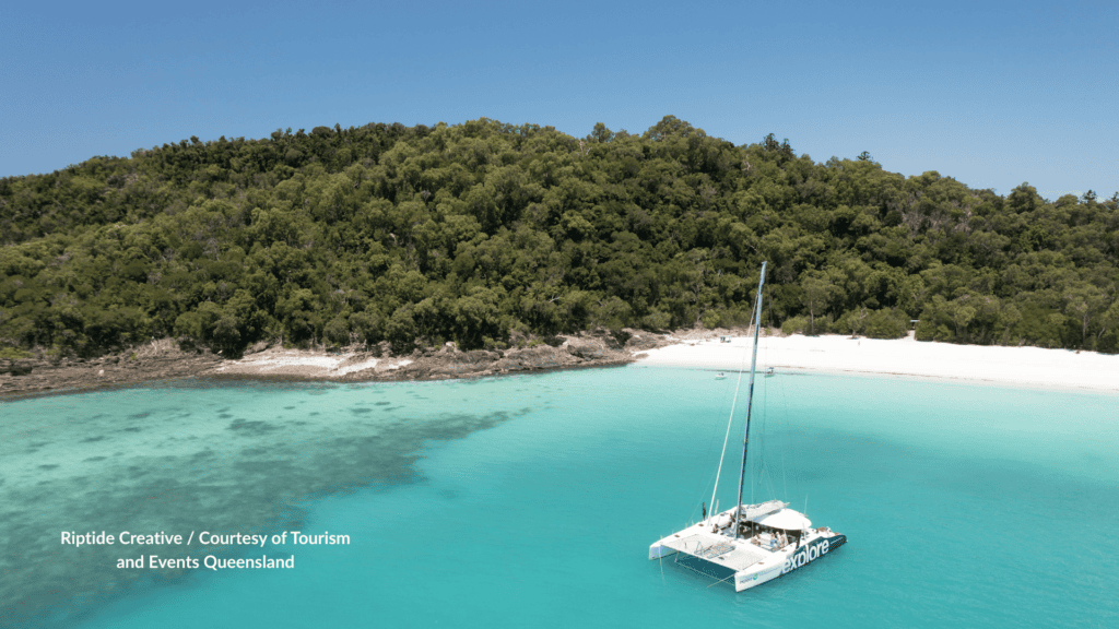 Tour catamaran anchored off Whitehaven Beach Whitsundays Queensland