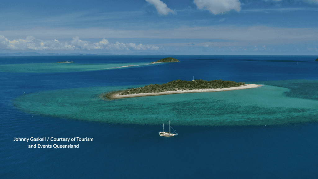 Aerial view of Black Island and Bali Hai with a yacht in the Whitsundays Queensland