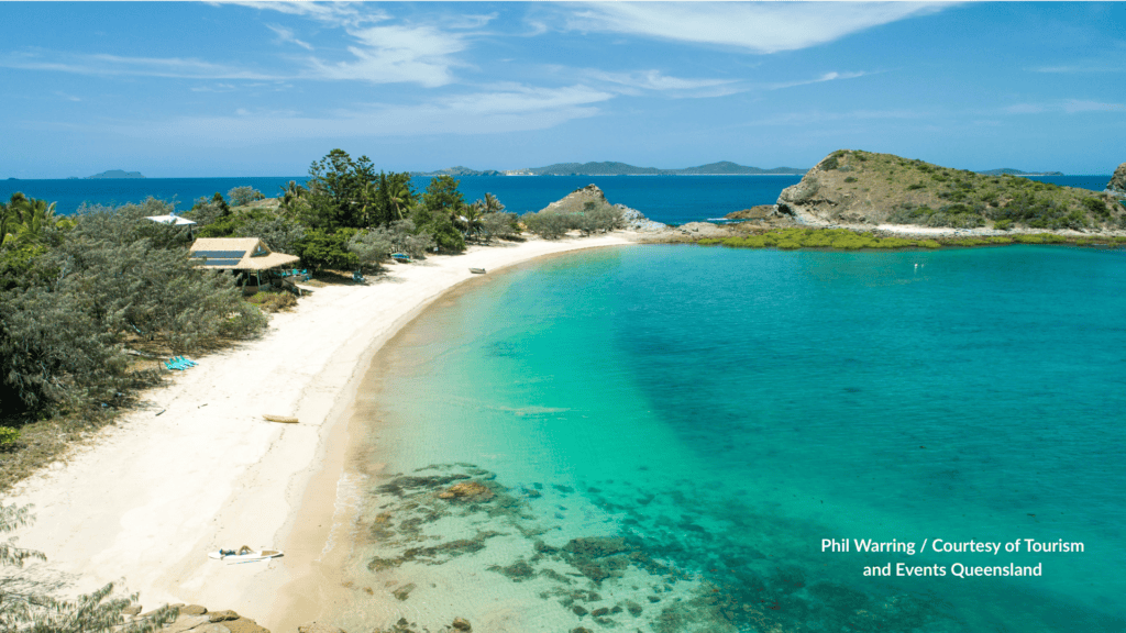 Pumpkin Island Beach with cabins and turquoise water off the Capricorn Coast in Queensland